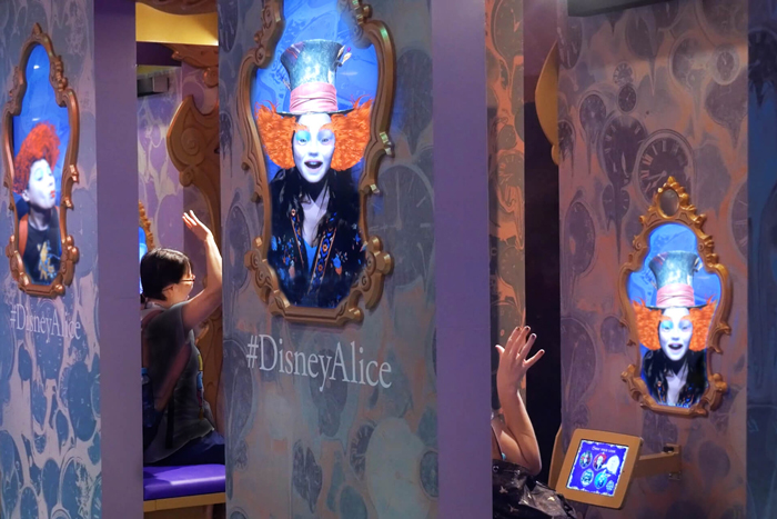 Close-up of a guest transformed into a Wonderland character in the mirror
