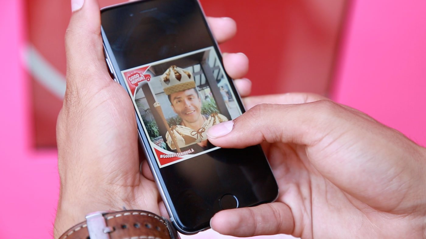 Phone displaying a guest's captured King Cone character photo