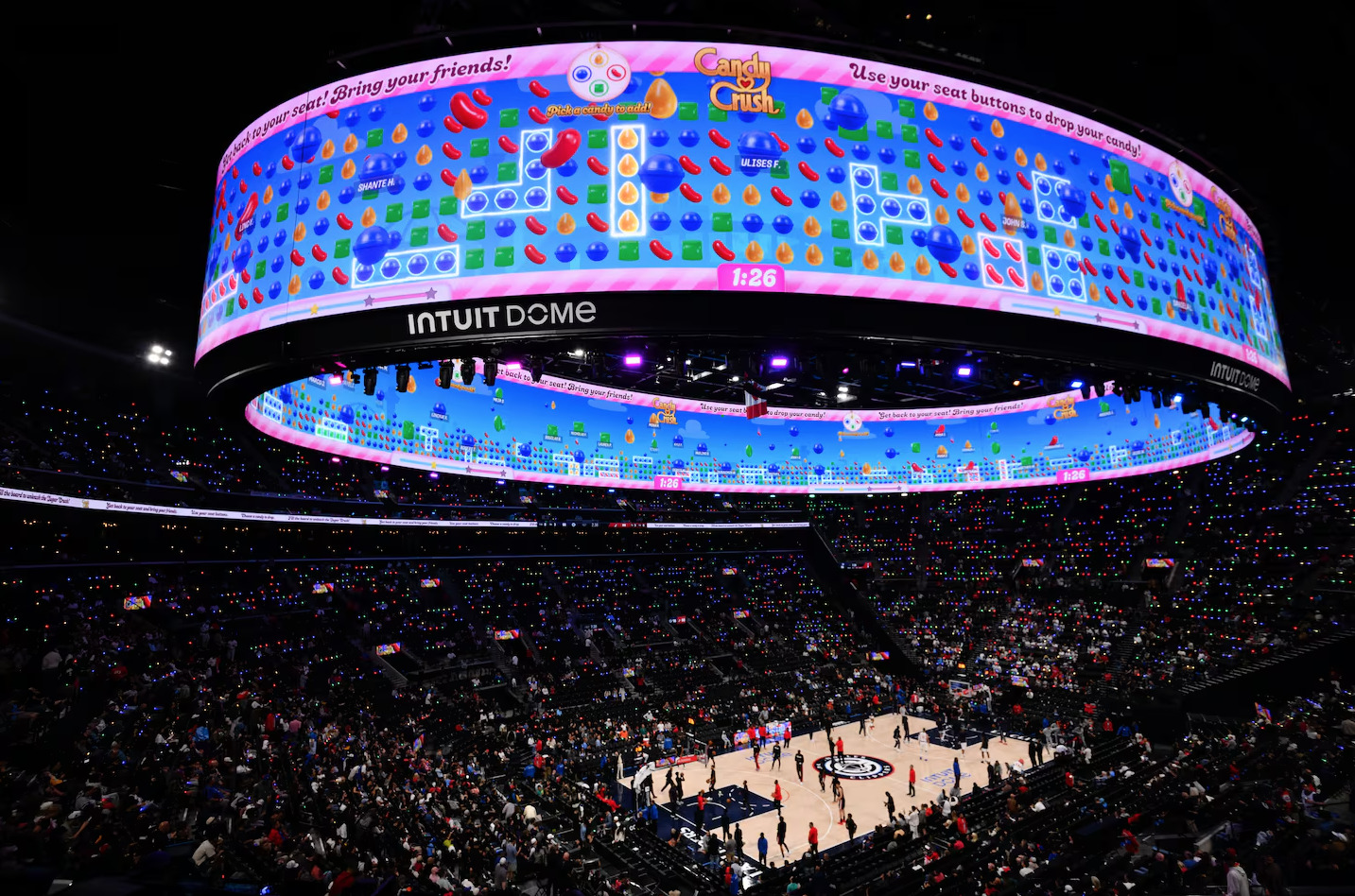 A packed Intuit Dome bowl with the 233-million-pixel Halo screen glowing overhead during a Clippers game