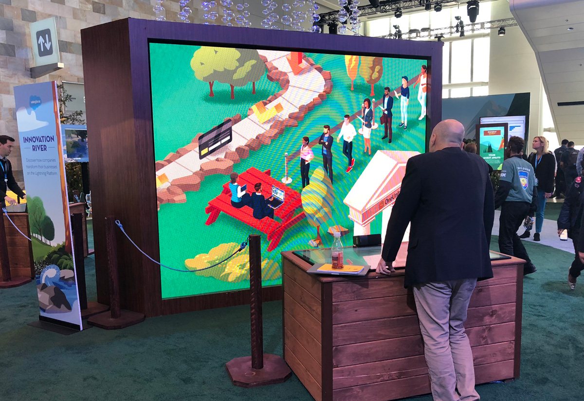 Close-up of guests dragging raft paddles on the touchscreen table